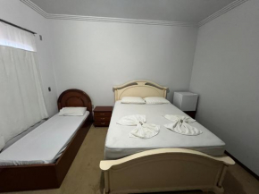 Quarto no centro com 2 camas e hidromassagem